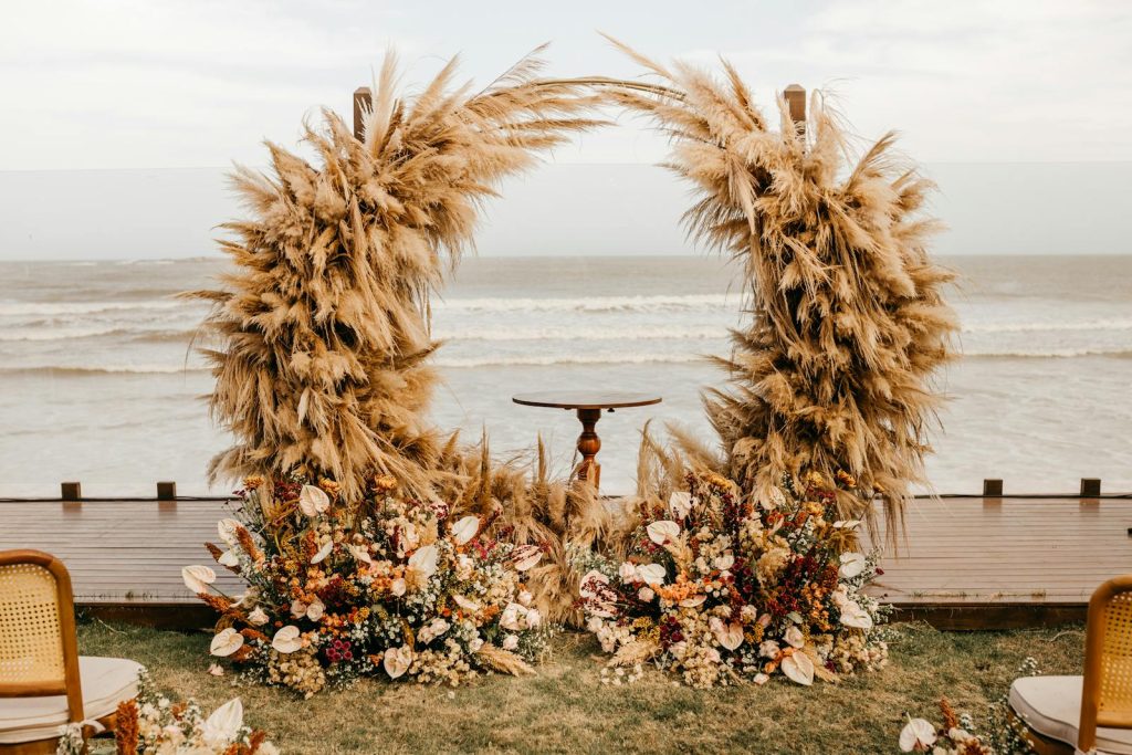 Wedding Arch with Flowers and Straw Decoration