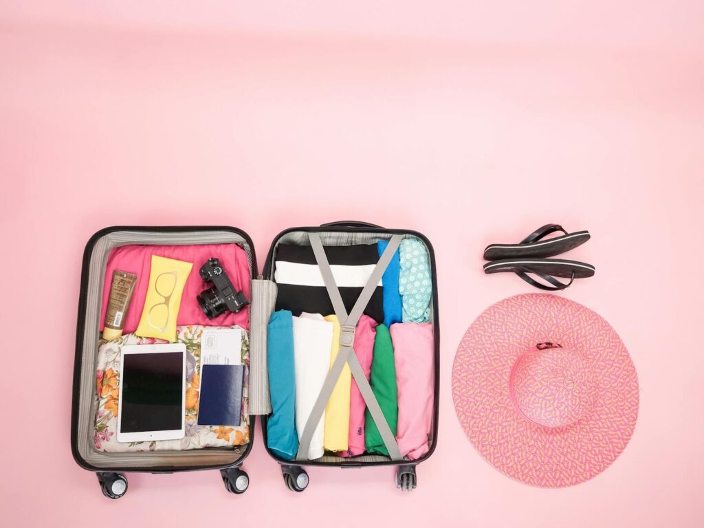 organized suitcase with honeymoon planning essentials